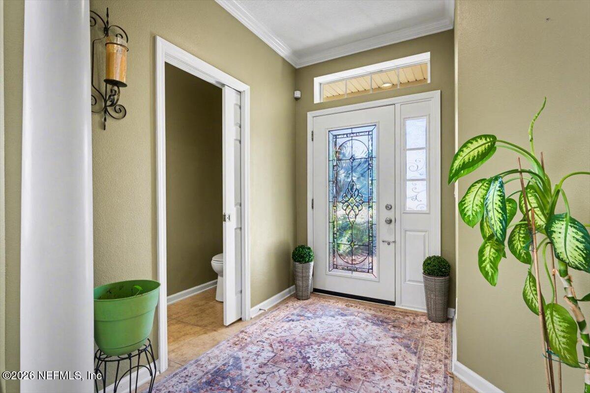 8131 Broward Cove Road Jacksonville, FL 32218 - Photo 6 of 35 a view of an entryway with a potted plant
