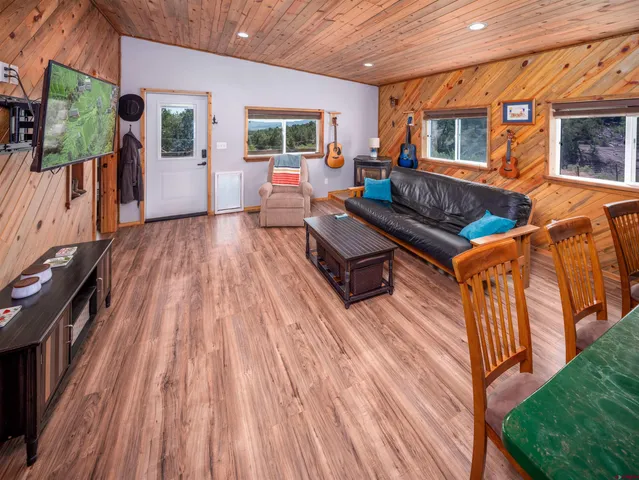 a outdoor space with patio furniture and wooden floor