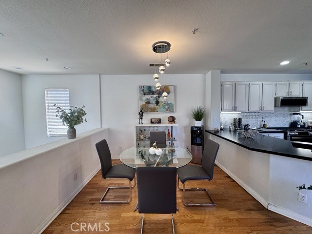 33423 Winston Way, Unit C Temecula, CA 92592 - Photo 12 of 39 a dining room with furniture and window