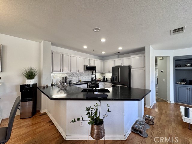 33423 Winston Way, Unit C Temecula, CA 92592 - Photo 14 of 39 a kitchen with stainless steel appliances granite countertop a sink refrigerator and cabinets