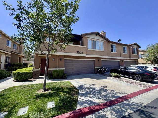 33423 Winston Way, Unit C Temecula, CA 92592 - Photo 2 of 39 a front view of a house with a yard
