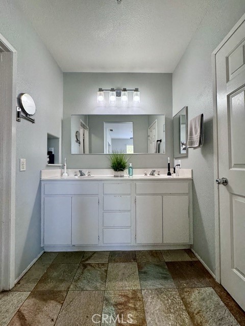 33423 Winston Way, Unit C Temecula, CA 92592 - Photo 31 of 39 a bathroom with a sink and a mirror