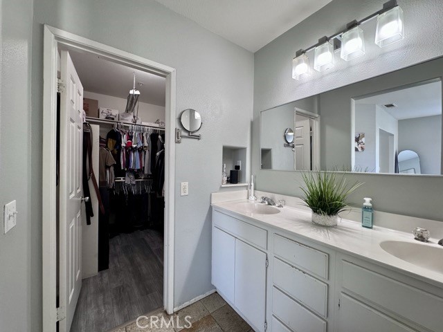 33423 Winston Way, Unit C Temecula, CA 92592 - Photo 32 of 39 a en suite bathroom with a sink and mirror