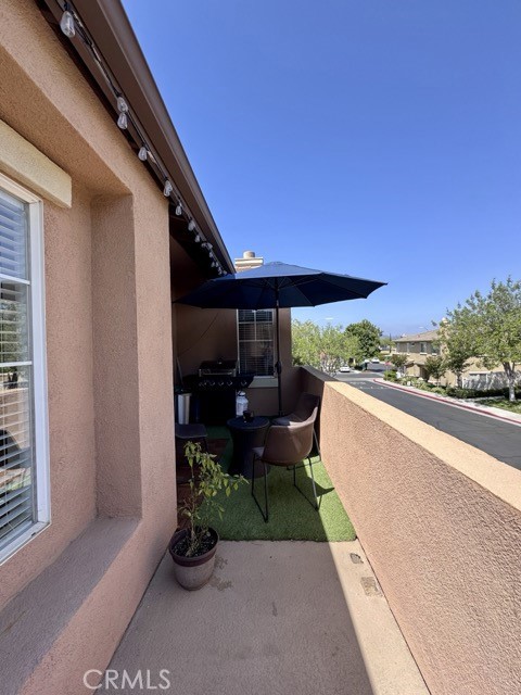 33423 Winston Way, Unit C Temecula, CA 92592 - Photo 36 of 39 a balcony with furniture and a potted plant