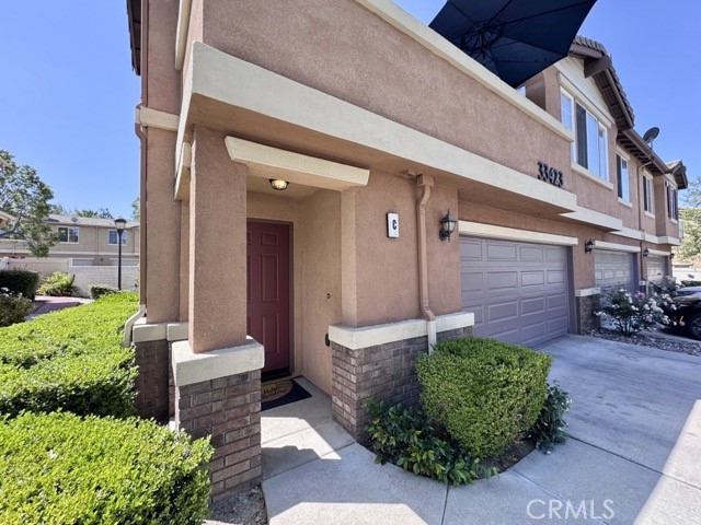 33423 Winston Way, Unit C Temecula, CA 92592 - Photo 5 of 39 a front view of a house with garden