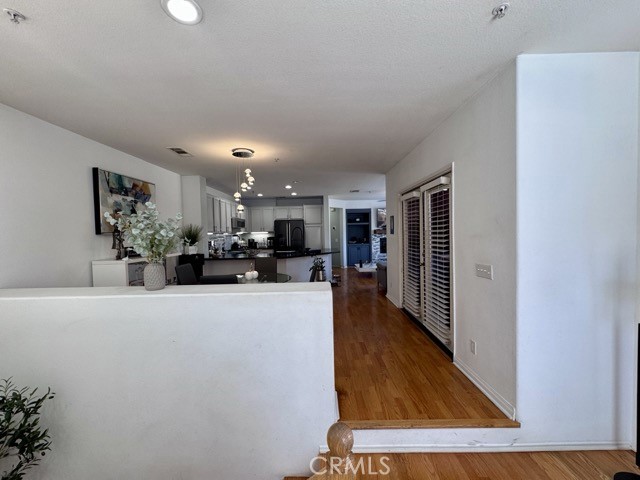 33423 Winston Way, Unit C Temecula, CA 92592 - Photo 10 of 39 a view of kitchen with furniture and wooden floor
