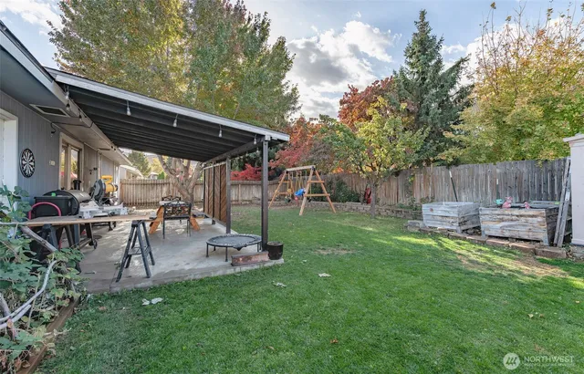 a view of a backyard with sitting area