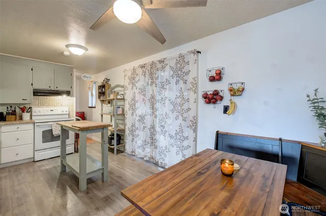 a workspace with furniture and wooden floor