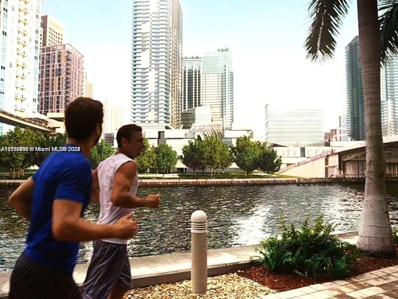 999 Southwest 1st Avenue, Unit 2115 Miami, FL 33130 - Photo 16 of 27 a view of swimming pool of water with lawn chairs