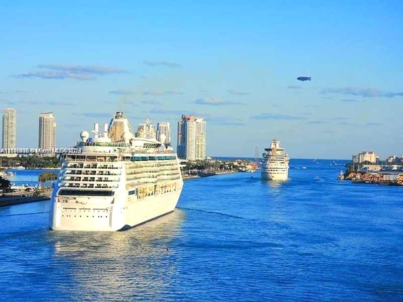 999 Southwest 1st Avenue, Unit 2115 Miami, FL 33130 - Photo 22 of 27 a view of living room with furniture and wooden floor