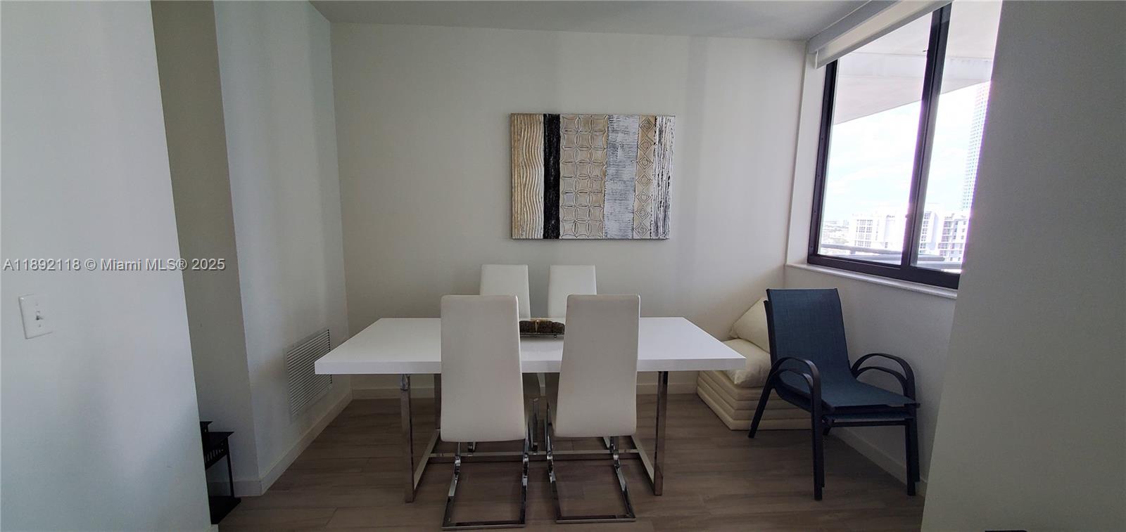 999 Southwest 1st Avenue, Unit 2115 Miami, FL 33130 - Photo 24 of 27 a view of a workspace with furniture and a window