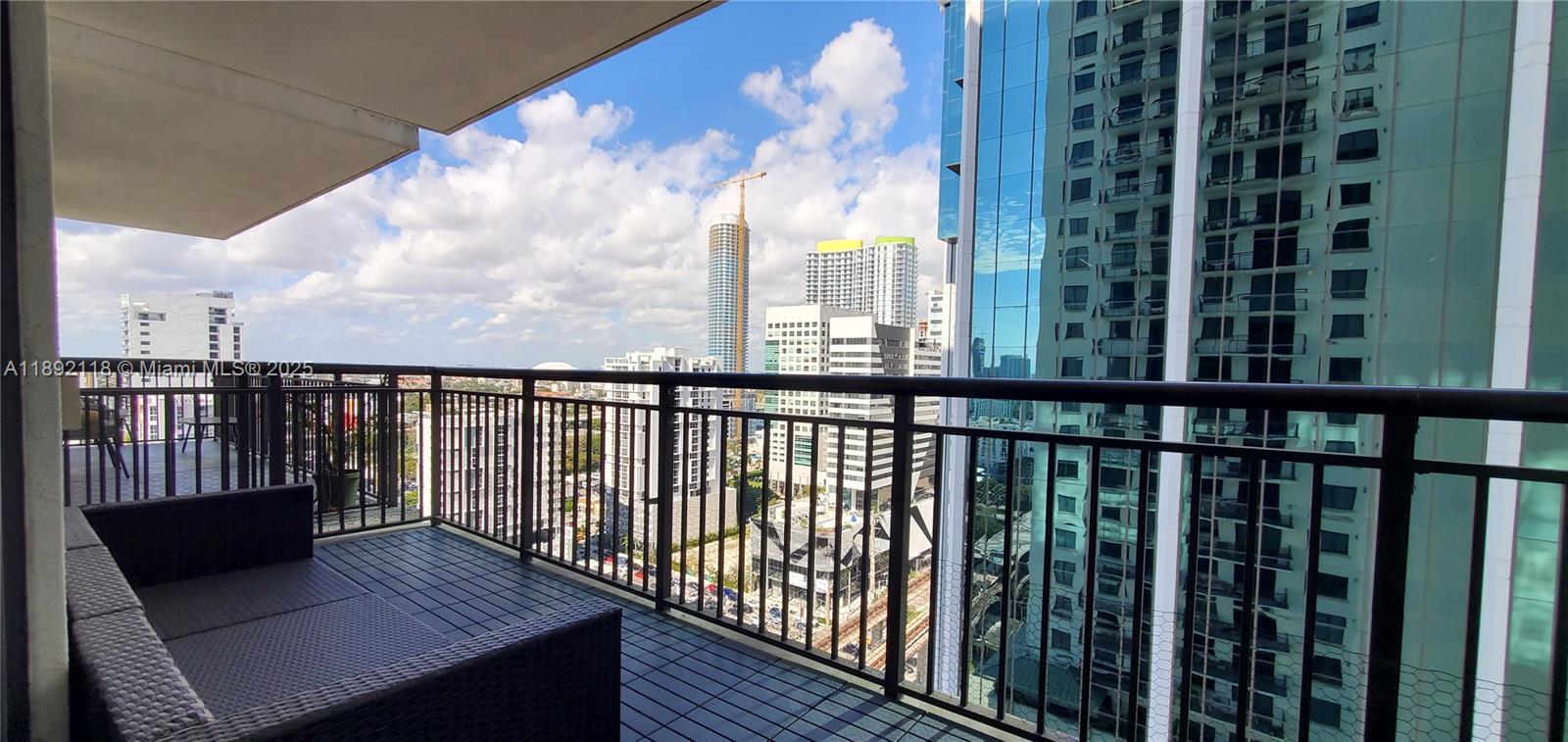 999 Southwest 1st Avenue, Unit 2115 Miami, FL 33130 - Photo 27 of 27 a view of a balcony with wooden floor