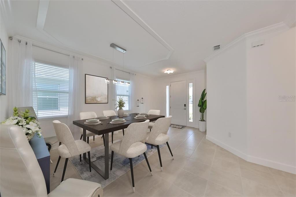 933 Signet Drive Apollo Beach, FL 33572 - Photo 14 of 66 a view of a dining room with furniture and window