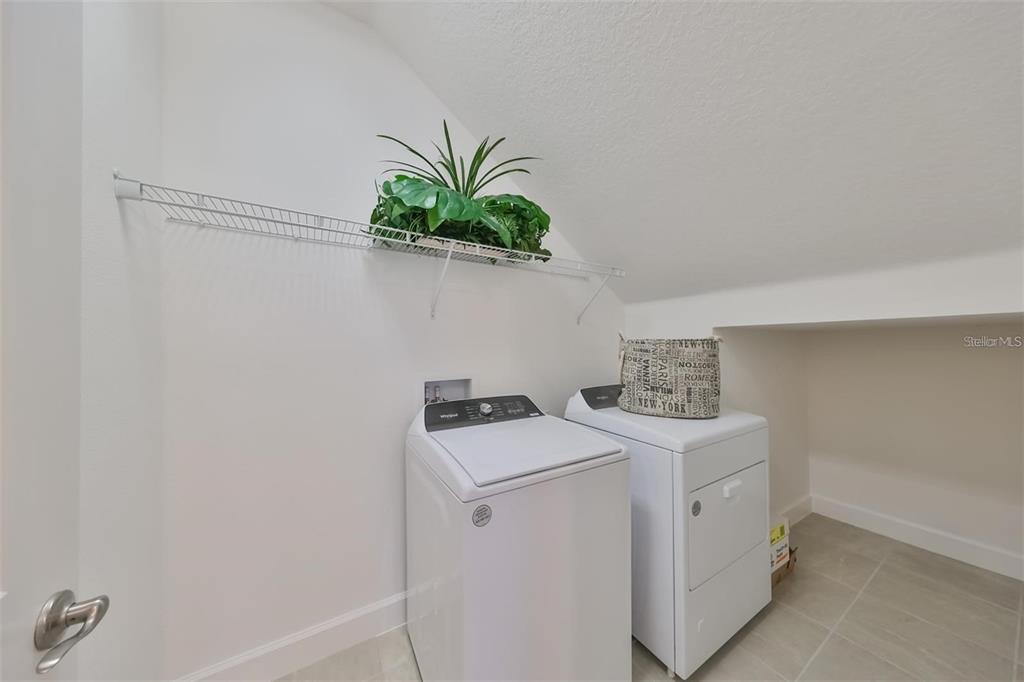 933 Signet Drive Apollo Beach, FL 33572 - Photo 25 of 66 a utility room with dryer and washer