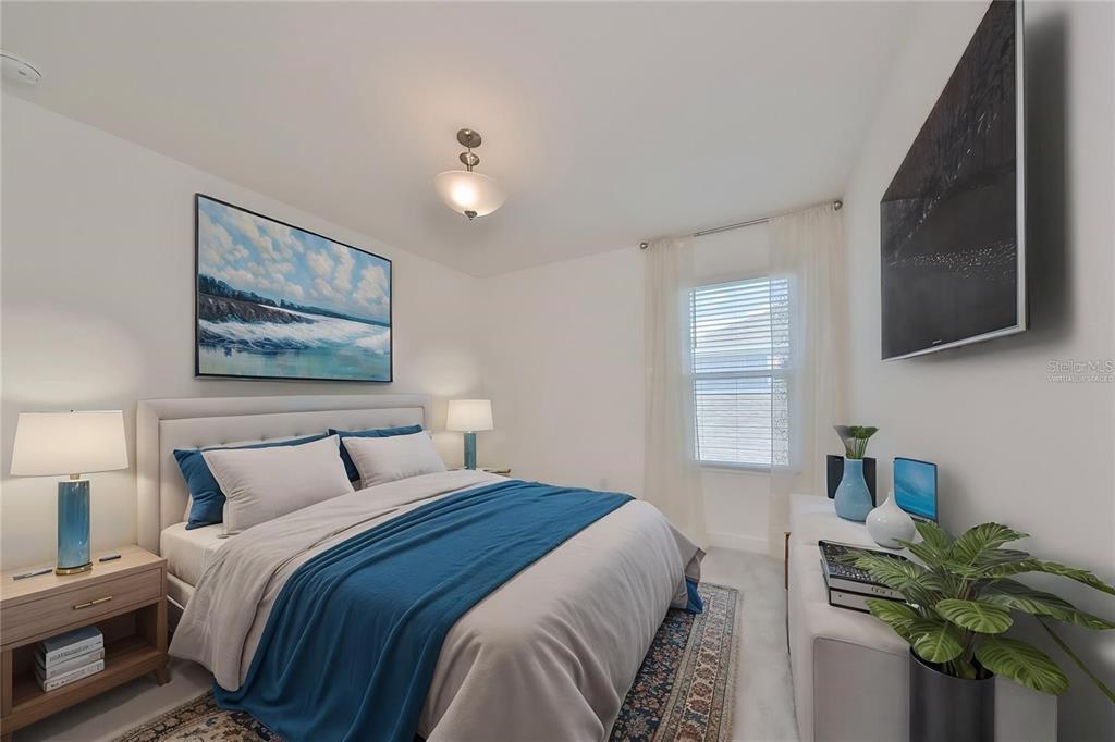 933 Signet Drive Apollo Beach, FL 33572 - Photo 28 of 66 a bedroom with a bed and a painting on the wall