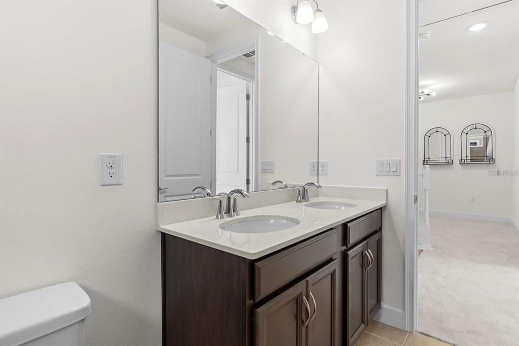 933 Signet Drive Apollo Beach, FL 33572 - Photo 39 of 66 a bathroom with a sink and a mirror