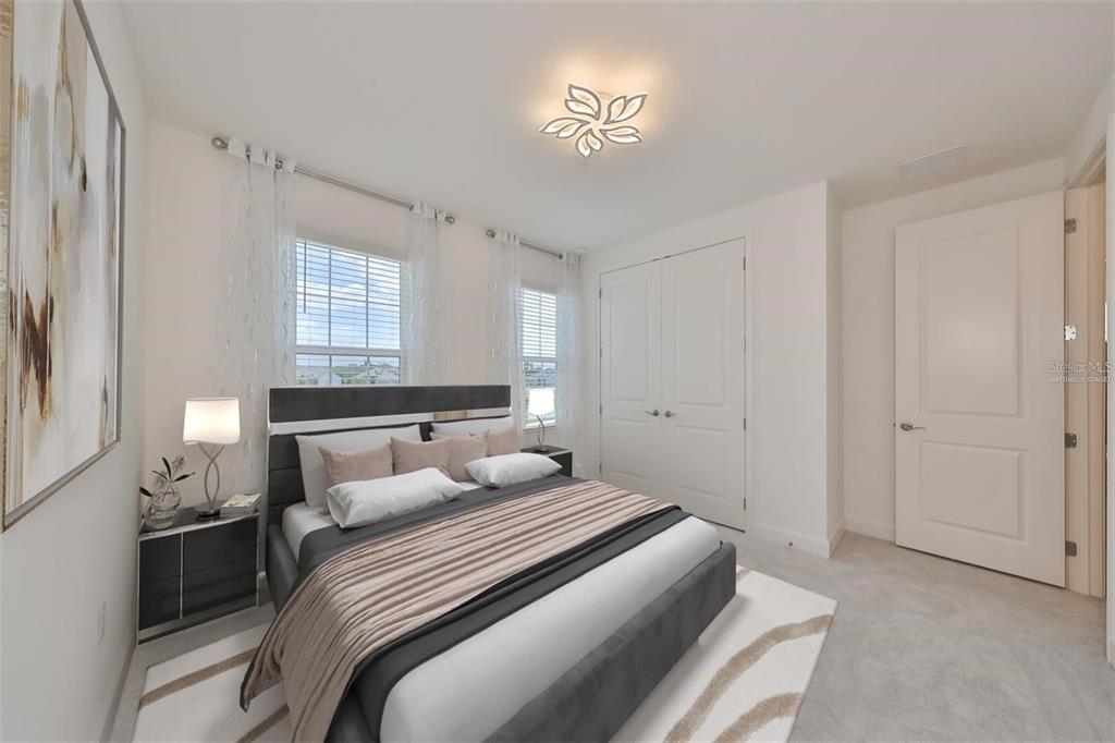 933 Signet Drive Apollo Beach, FL 33572 - Photo 40 of 66 a bedroom with a bed and a window