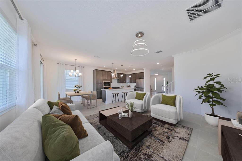 933 Signet Drive Apollo Beach, FL 33572 - Photo 4 of 66 a living room with furniture potted plant and a window