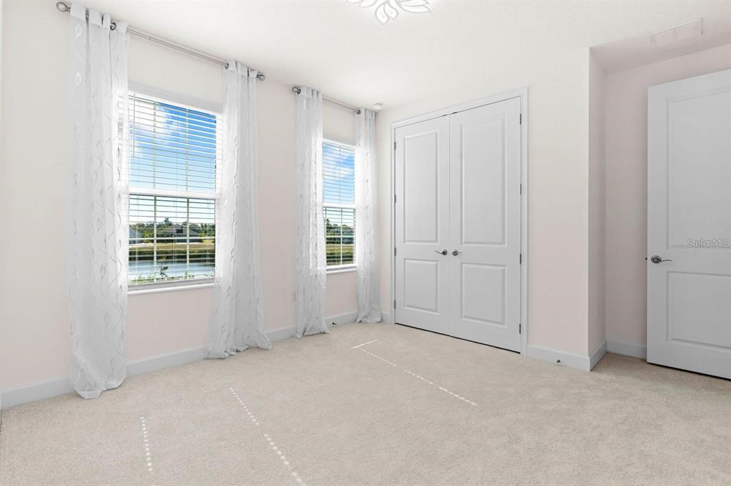 933 Signet Drive Apollo Beach, FL 33572 - Photo 41 of 66 an empty room with windows