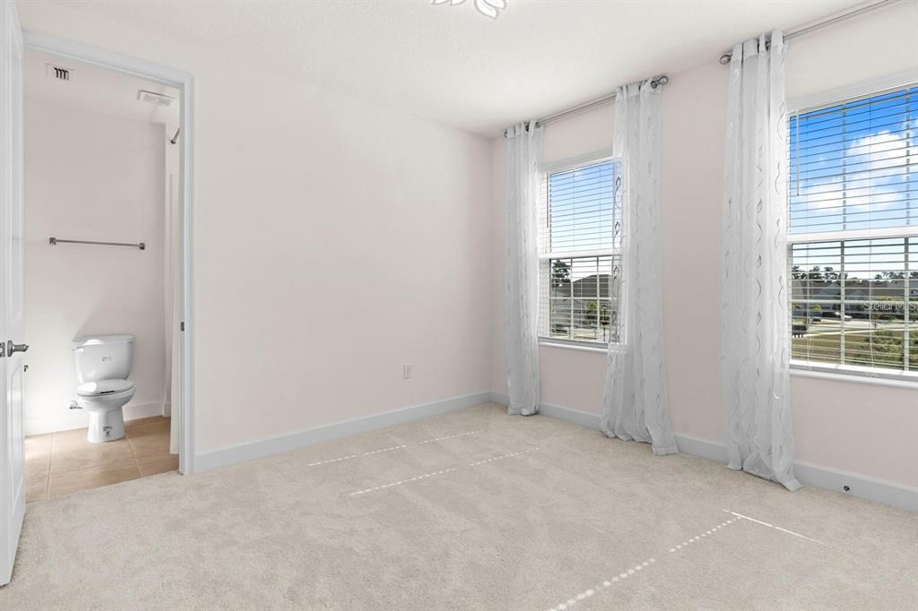 933 Signet Drive Apollo Beach, FL 33572 - Photo 42 of 66 a view of an empty room with a window and bathroom
