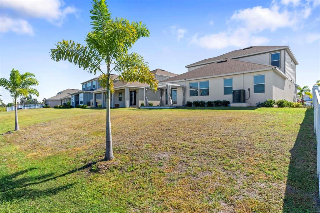 933 Signet Drive Apollo Beach, FL 33572 - Photo 48 of 66 a front view of a house with a yard