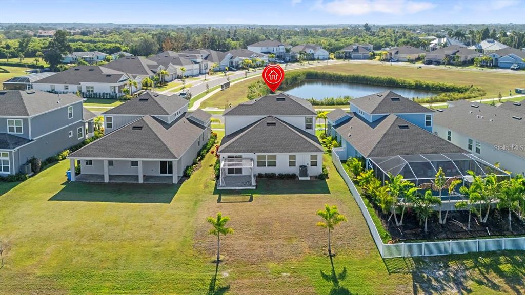 933 Signet Drive Apollo Beach, FL 33572 - Photo 52 of 66 an aerial view of residential houses with outdoor space and swimming pool