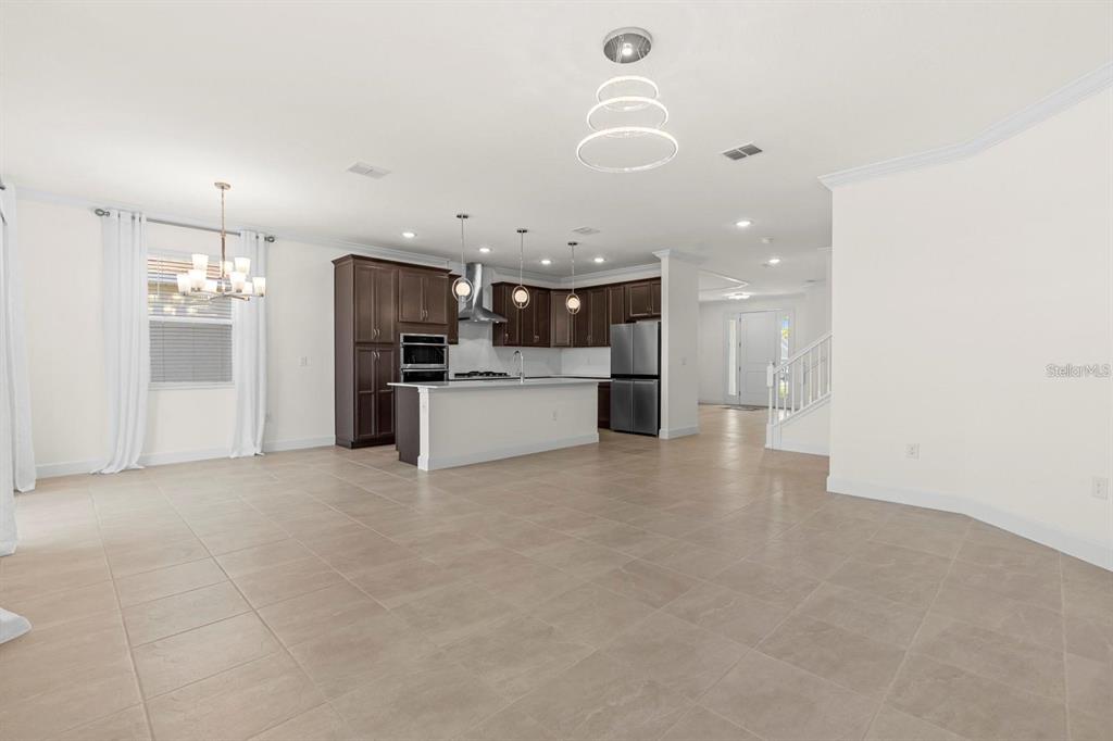 933 Signet Drive Apollo Beach, FL 33572 - Photo 10 of 66 a view of a kitchen with a sink and a refrigerator