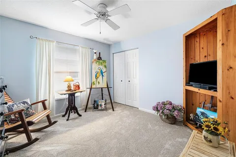 a view of a livingroom with furniture and a flat screen tv
