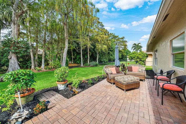 a view of a backyard with sitting area