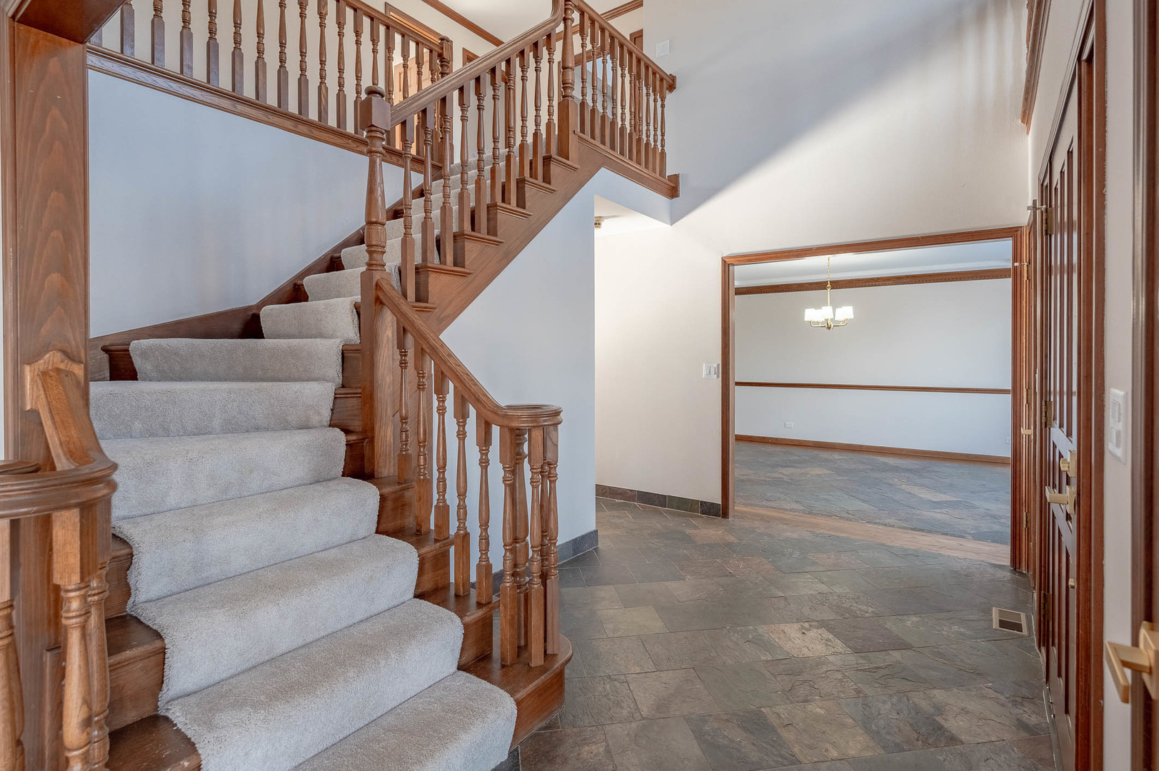 501 Bryan Trail New Lenox, IL 60451 - Photo 2 of 24 a view of staircase with wooden floor and white walls