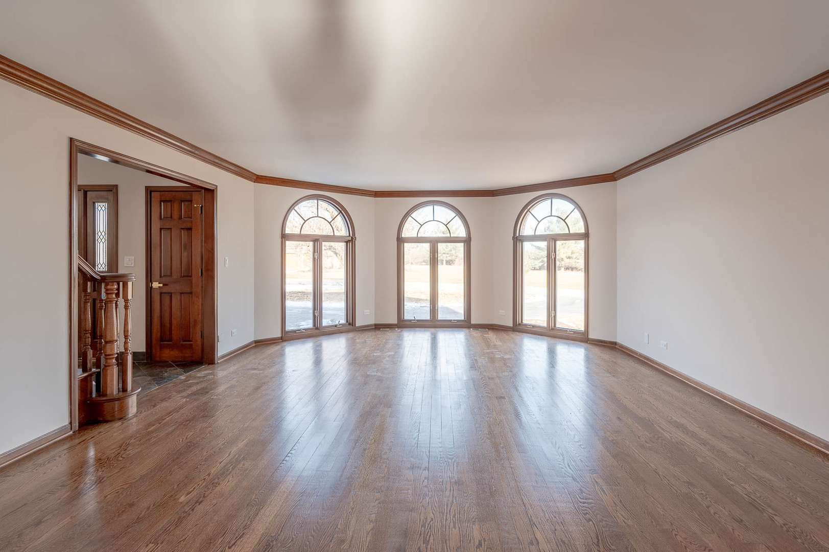 501 Bryan Trail New Lenox, IL 60451 - Photo 3 of 24 an empty room with wooden floor and windows