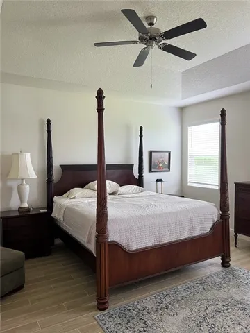 a bedroom with a bed and window