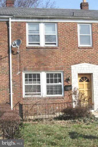 1606 Northwick Road Baltimore, MD 21218 - Photo 1 of 1 a front view of a house with a yard