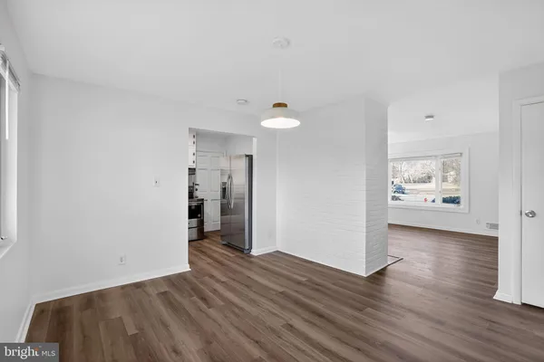 a view of a livingroom with wooden floor