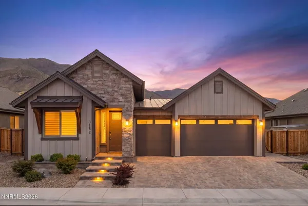 a kitchen with stainless steel appliances granite countertop a stove a sink a microwave oven with a dining table and chairs