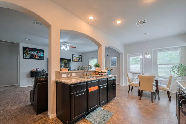 a kitchen with a stove and a refrigerator