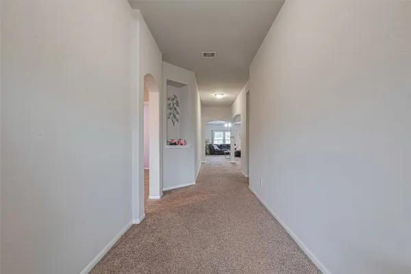 a view of a hallway with a couch