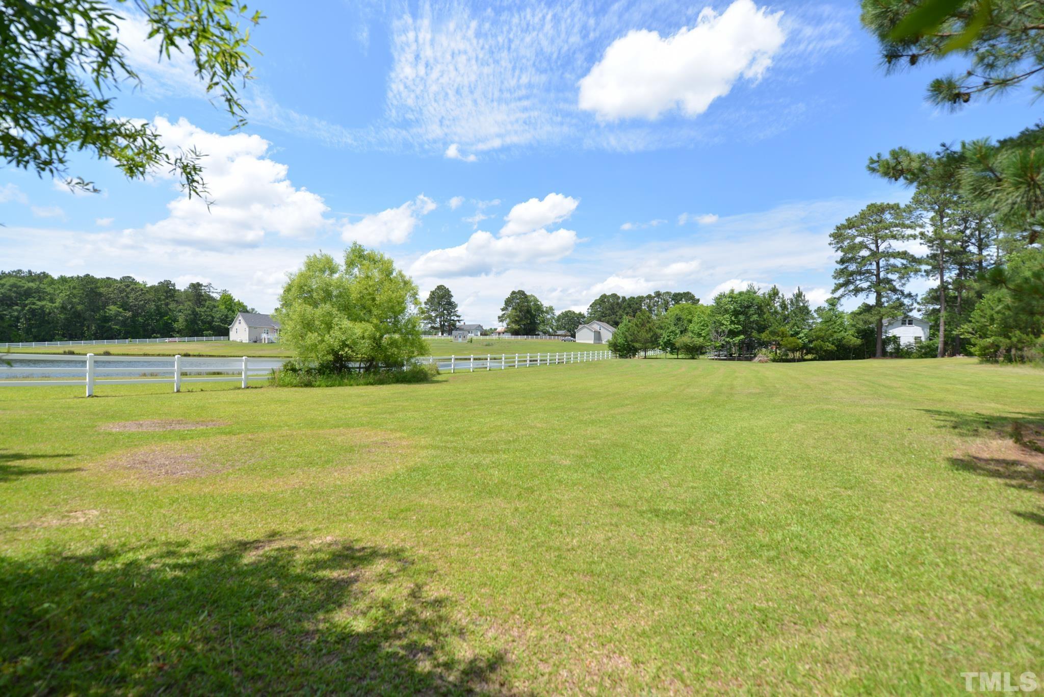 6337 B Zacks Mill Road Angier, NC 27501 - Photo 7 of 7 a view of a fountain with a big yard