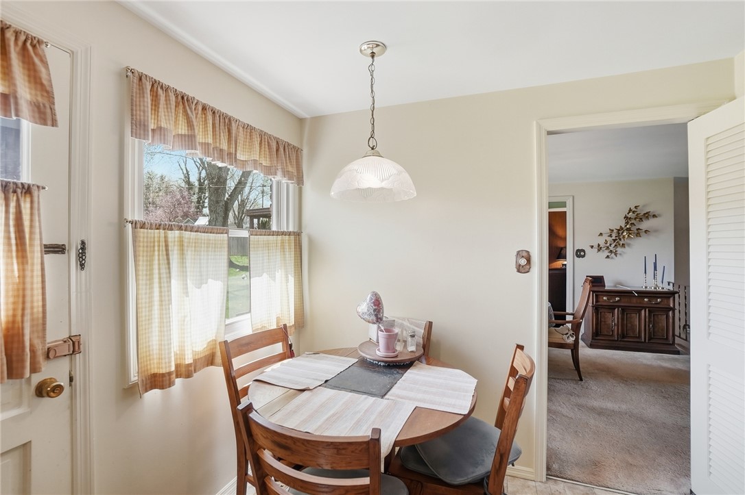 6225 Possum Run Road Bellbrook, OH 45305 - Photo 14 of 33 This cozy dining area features a bright window and seamless flow to adjacent living spaces.