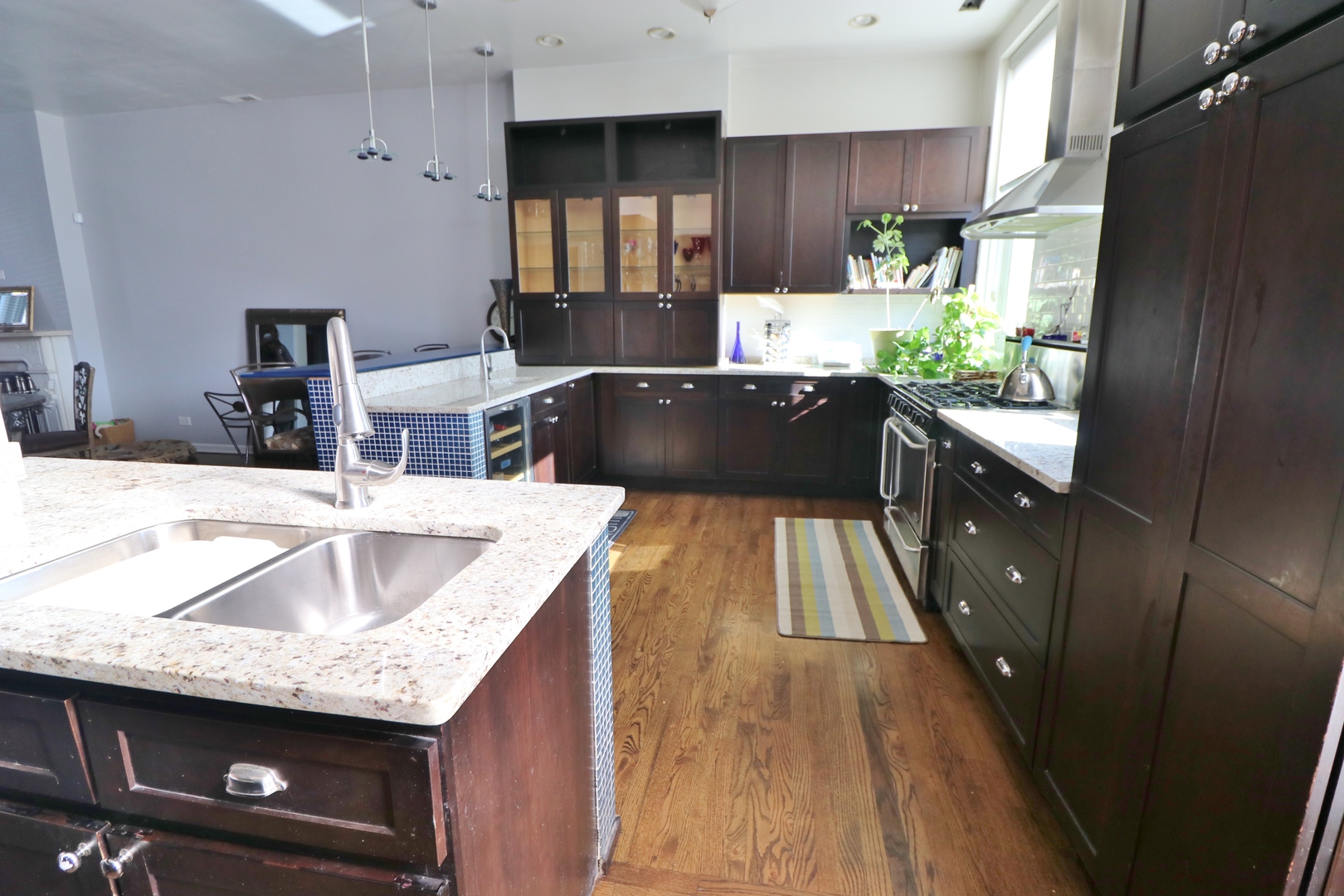 3339 South Giles Avenue Chicago, IL 60616 - Photo 17 of 38 a kitchen with granite countertop a sink a counter and cabinets
