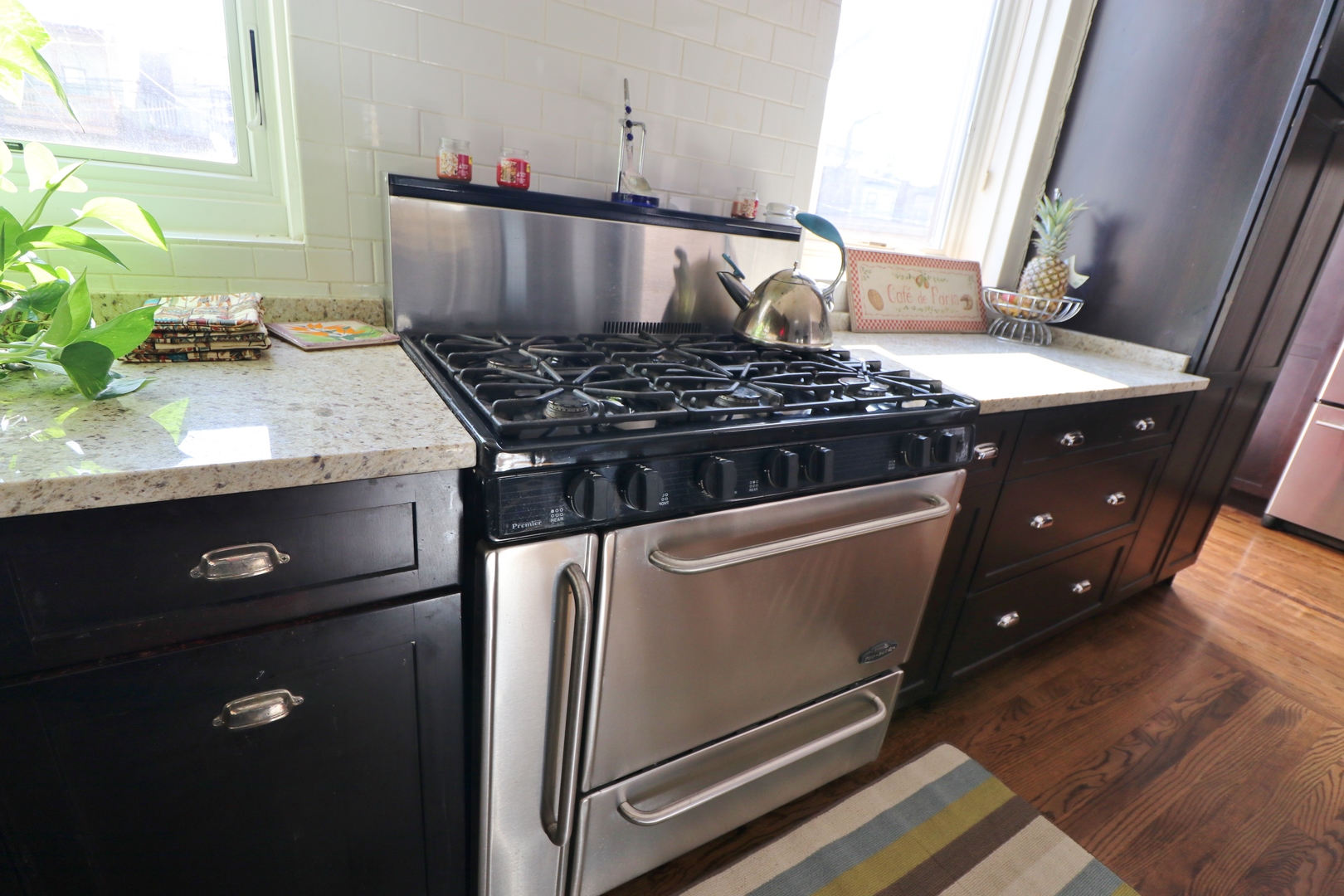 3339 South Giles Avenue Chicago, IL 60616 - Photo 19 of 38 a kitchen with a stove and a wooden floor