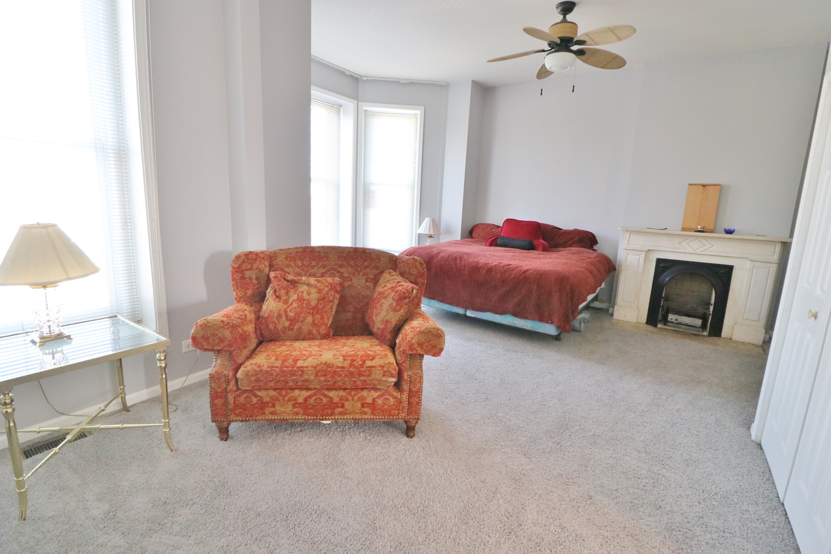 3339 South Giles Avenue Chicago, IL 60616 - Photo 30 of 38 a bedroom with furniture and a fireplace