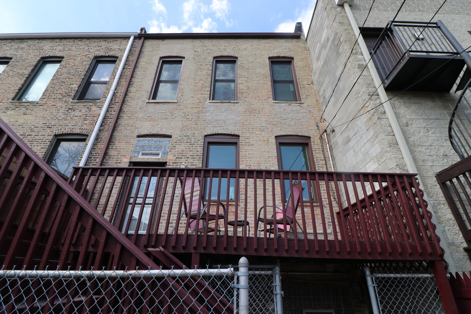 3339 South Giles Avenue Chicago, IL 60616 - Photo 35 of 38 a view of a brick house with iron stairs