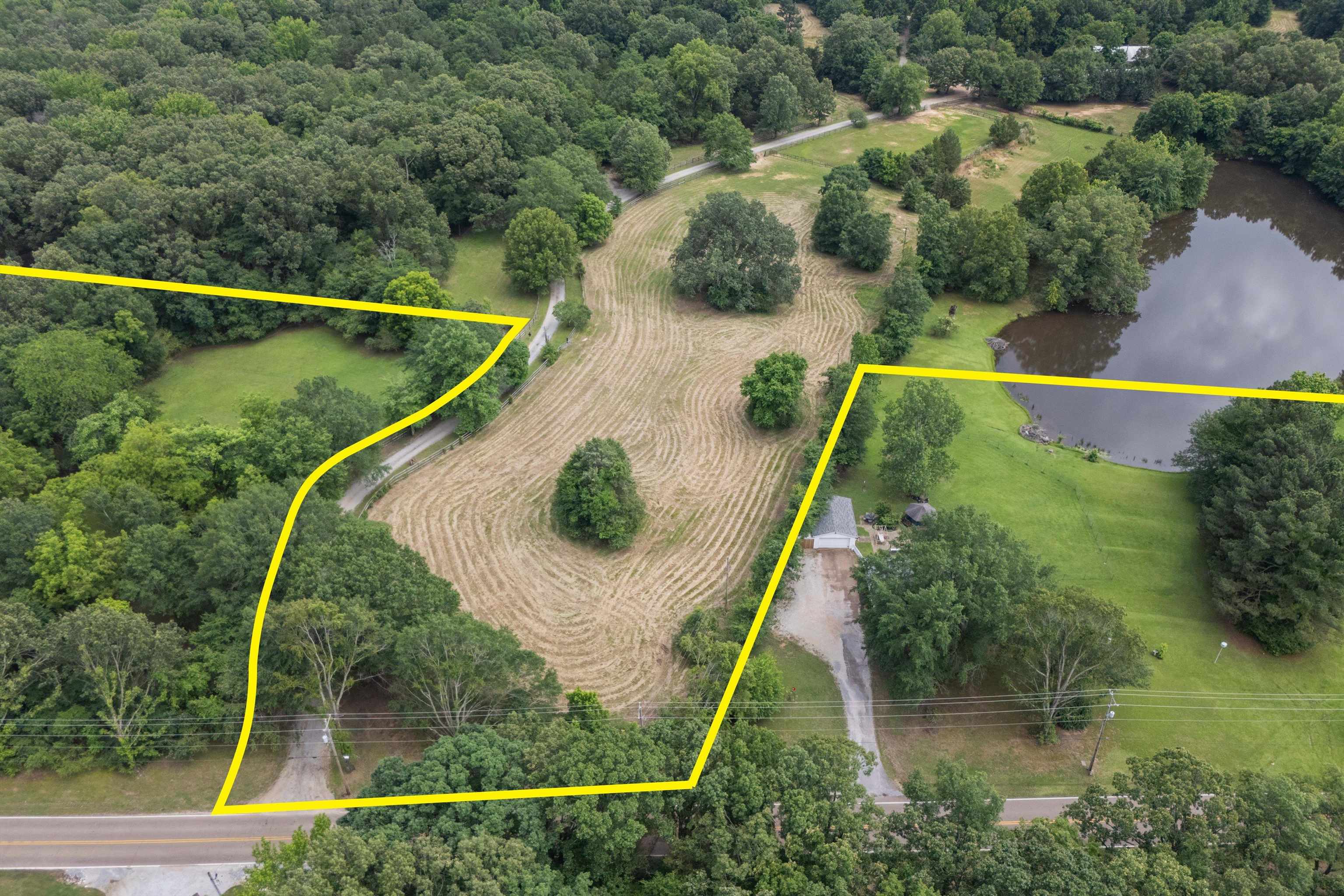 10409-10445 Raleigh Lagrange Road East Eads, TN 38028 - Photo 6 of 17 Aerial view of property and surrounding area with a large body of water and property parcel outlined