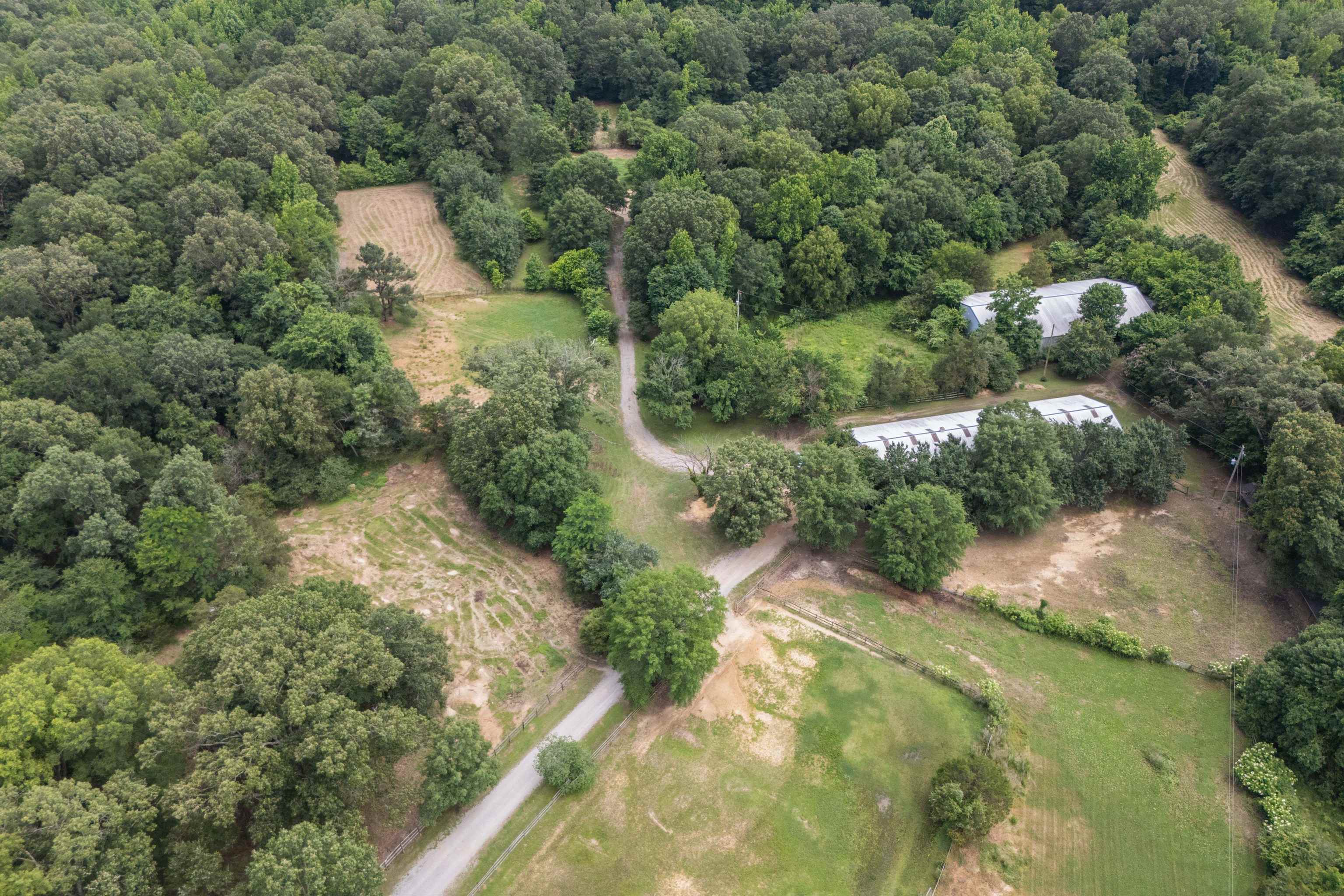 10409-10445 Raleigh Lagrange Road East Eads, TN 38028 - Photo 7 of 17 Aerial view of property and surrounding area featuring a forest