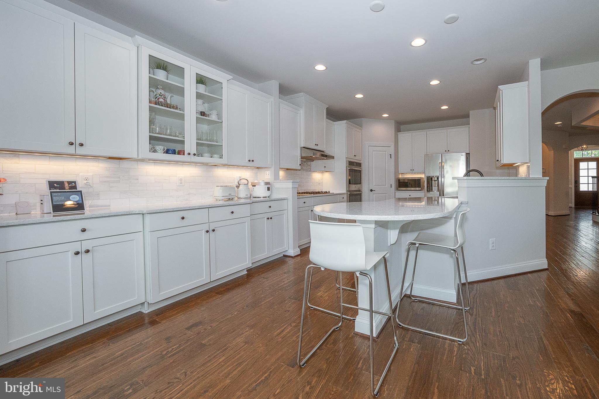 500 Quarry Point Road Malvern, PA 19355 - Photo 17 of 45 a kitchen with a sink cabinets and wooden floor