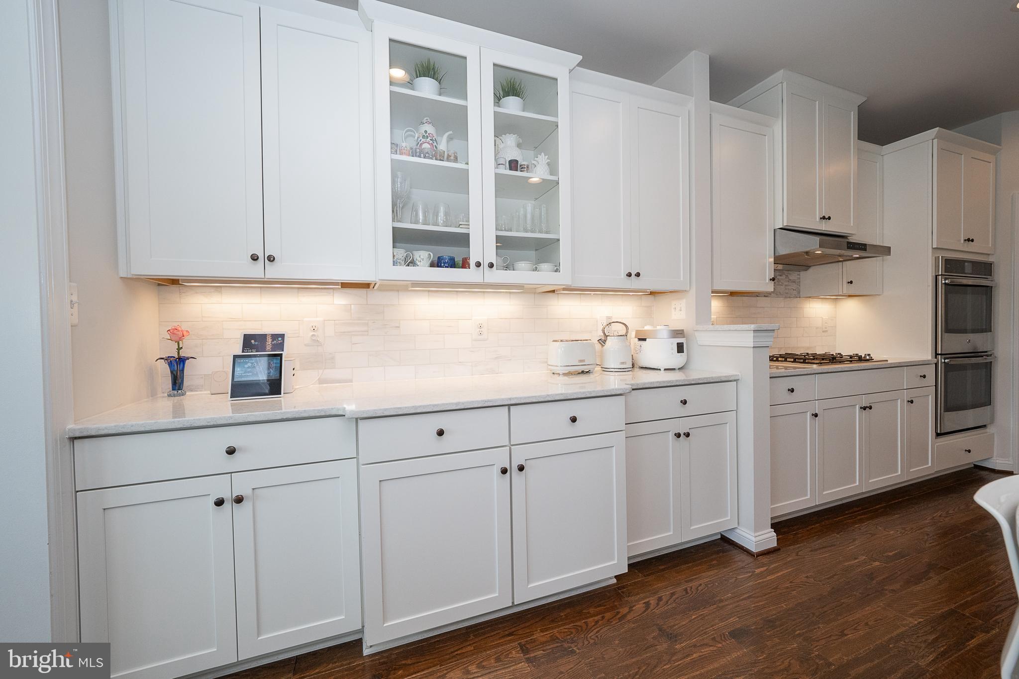 500 Quarry Point Road Malvern, PA 19355 - Photo 18 of 45 a kitchen with white cabinets and white appliances
