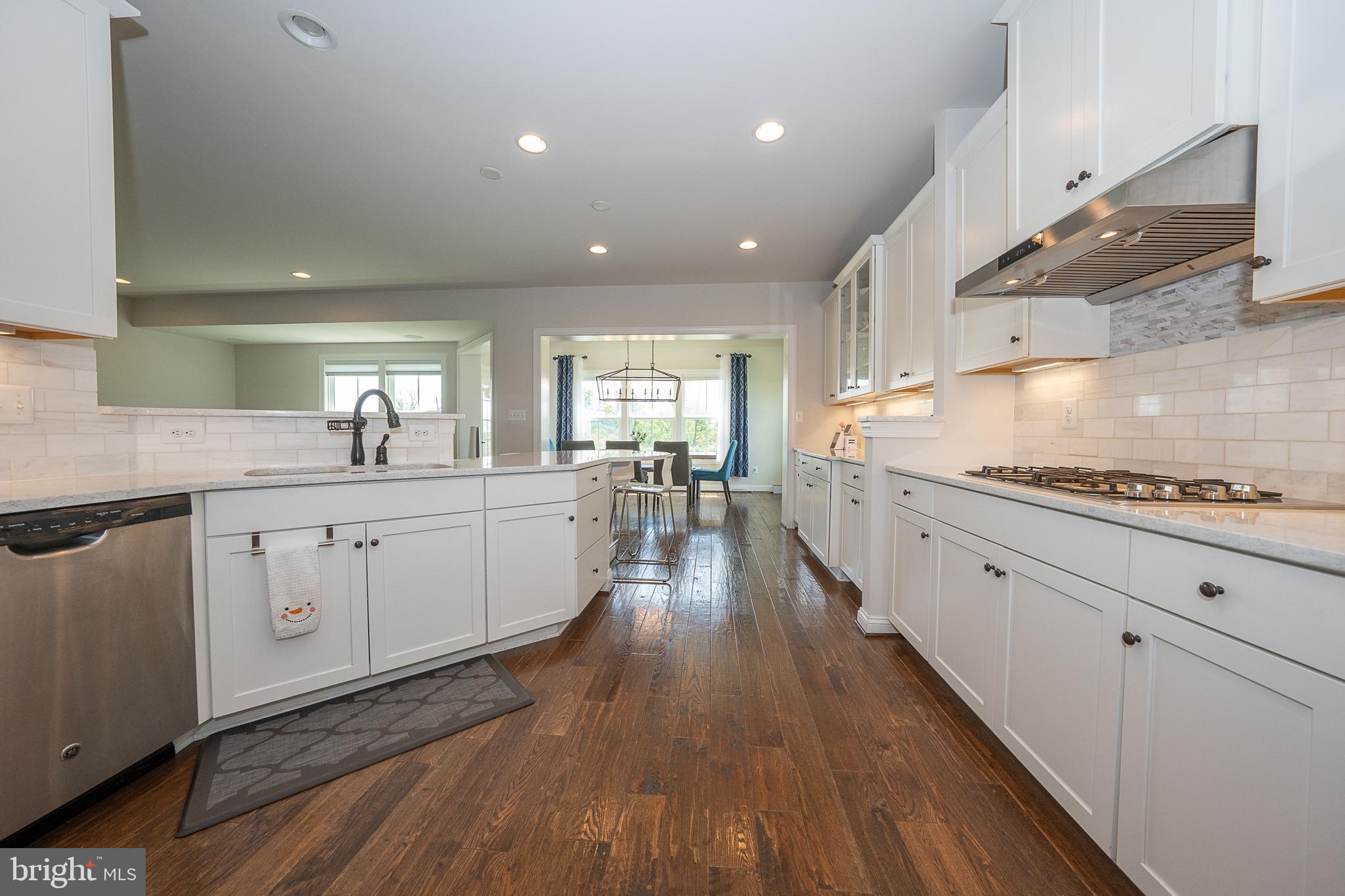 500 Quarry Point Road Malvern, PA 19355 - Photo 21 of 45 a large kitchen with cabinets wooden floor and stainless steel appliances