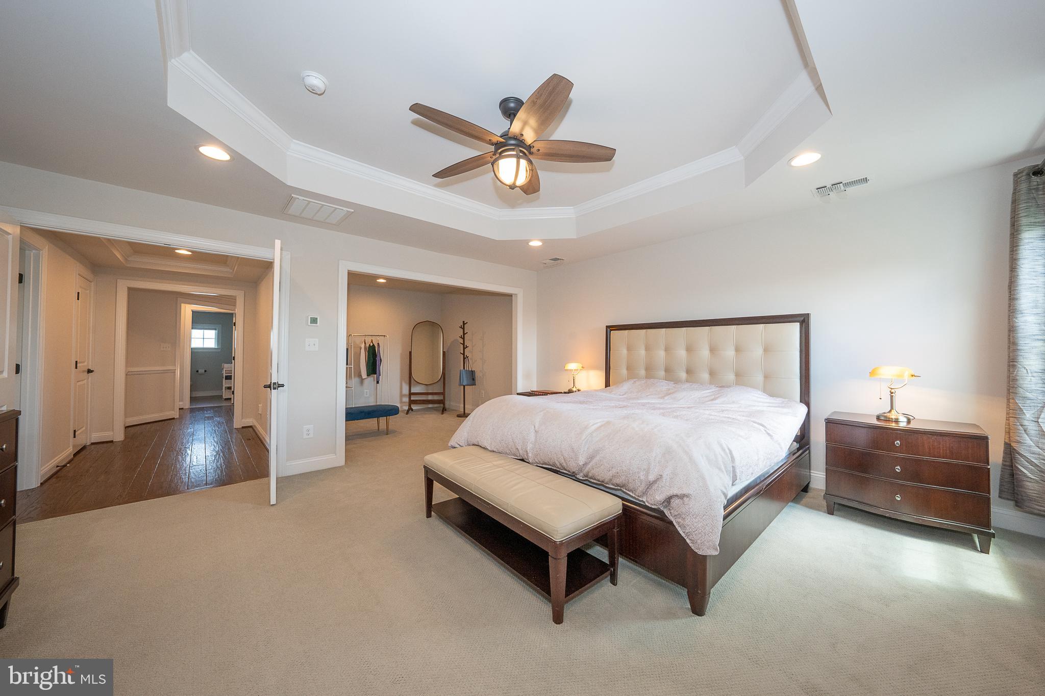 500 Quarry Point Road Malvern, PA 19355 - Photo 32 of 45 a spacious bedroom with a bed and a chandelier