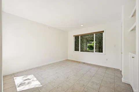 an empty room with closet area